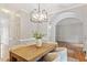 Elegant dining room with a modern chandelier and plenty of room for entertaining at 9400 Leslieshire Dr, Raleigh, NC 27615