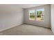 Carpeted bedroom featuring two windows providing natural light at 95 Cordoba Dr, Franklinton, NC 27525