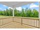 Rear porch featuring a stained wooden deck and wooded view at 95 Cordoba Dr, Franklinton, NC 27525