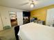 Comfortable bedroom showcasing a bright decor, hardwood floors, and convenient access to other areas at 96 Holly Cir, Henderson, NC 27537