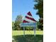 Sign for Camp Graham and 334 Regional Water Ln with a decorative sailboat accent at 96 Holly Cir, Henderson, NC 27537