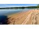 Picturesque lake view featuring a calm shoreline and clear, serene water at 96 Holly Cir, Henderson, NC 27537