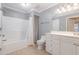 Spacious bathroom features a bathtub with a shower, a toilet, and vanity with ample storage and counter space at 1002 Kingswood Dr # A, Chapel Hill, NC 27517