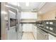 Modern kitchen with stainless steel appliances and granite counters, offering style and functionality at 1002 Kingswood Dr # A, Chapel Hill, NC 27517