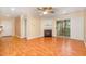 Cozy living area features a fireplace, ceiling fan, and sliding door to the outside at 1002 Kingswood Dr # A, Chapel Hill, NC 27517