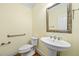 Powder room featuring a pedestal sink and comfort height toilet at 1010 Mill Pointe Way, Elon, NC 27244