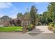Charming brick house with mature landscaping and a long driveway, perfect for a Gathering at 1010 Mill Pointe Way, Elon, NC 27244