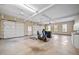 Spacious three car garage with a bicycle, trash cans and open garage doors at 1010 Mill Pointe Way, Elon, NC 27244
