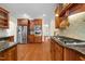Spacious kitchen with wood floors, stainless steel appliances and granite countertops at 1010 Mill Pointe Way, Elon, NC 27244