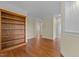 The living room features hardwood floors and custom built-in shelving at 1010 Mill Pointe Way, Elon, NC 27244