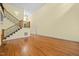 Spacious living room featuring hardwood floors and staircase access at 1010 Mill Pointe Way, Elon, NC 27244