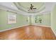 Main bedroom with hardwood floors, tray ceiling and plenty of natural light at 1010 Mill Pointe Way, Elon, NC 27244