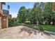 Inviting outdoor patio area with tiled flooring and metal railing, perfect for relaxation and entertaining at 1010 Mill Pointe Way, Elon, NC 27244