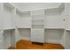 This walk-in closet has custom shelving, drawers, and ample storage space at 1010 Mill Pointe Way, Elon, NC 27244