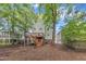 Back exterior of home featuring a wooden deck with stairs at 1011 Burch Ave, Durham, NC 27701