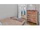 Bedroom with hardwood floors and bright pink accent furnishings at 1011 Burch Ave, Durham, NC 27701