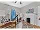 Cozy bedroom featuring a white painted fireplace and hardwood floors at 1011 Burch Ave, Durham, NC 27701