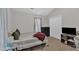 Comfortable bedroom with closet, TV, side table and warm lighting at 1011 Burch Ave, Durham, NC 27701