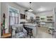 A well-lit kitchen featuring stainless steel appliances, bar seating and open design at 1011 Burch Ave, Durham, NC 27701