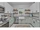 Well-equipped kitchen with stainless steel appliances, ample counter space, and stylish decor at 1011 Burch Ave, Durham, NC 27701