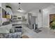 A well-lit kitchen featuring stainless steel appliances, island and plentiful cabinet space at 1011 Burch Ave, Durham, NC 27701