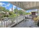 Relaxing porch with view of street lined with beautiful foliage and houses at 1011 Burch Ave, Durham, NC 27701