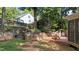 The backyard is perfect for entertaining with a deck, stone terrace, and lush landscaping at 104 Kylesku Ct, Apex, NC 27502
