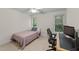 Bedroom with carpeted floors, neutral walls, and a desk area at 104 Kylesku Ct, Apex, NC 27502