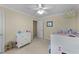 bedroom with a fun chandelier, neutral walls, and ample play space at 104 Kylesku Ct, Apex, NC 27502