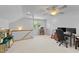 The bonus room features a play area, office space with lots of natural light and a neutral color palette at 104 Kylesku Ct, Apex, NC 27502