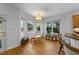 Bright breakfast nook features hardwood floors and a charming bay window overlooking the backyard at 104 Kylesku Ct, Apex, NC 27502