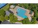 Aerial view of sparkling community pool, slide, and lounge area, perfect for relaxation at 104 Kylesku Ct, Apex, NC 27502