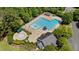 Overhead view of the community pool with a slide, a splash pool, and lounge chairs for residents at 104 Kylesku Ct, Apex, NC 27502