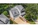 Inviting home features a charming front porch, attached garage, and landscaped front yard at 104 Kylesku Ct, Apex, NC 27502