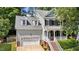 Charming home features a charming front porch, attached garage, and landscaped front yard at 104 Kylesku Ct, Apex, NC 27502