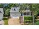 Charming two-story home with a welcoming front porch, dormer windows and an attached two car garage at 104 Kylesku Ct, Apex, NC 27502