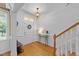 Welcoming foyer featuring hardwood floors, staircase, and bright natural light at 104 Kylesku Ct, Apex, NC 27502