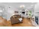 Comfortable living room features fireplace, hardwood flooring, and a relaxing space for gathering at 104 Kylesku Ct, Apex, NC 27502