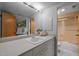 Bright bathroom with an extended vanity, large mirror, and a glass-door shower at 106 Mill Rock Ct, Carrboro, NC 27510