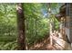 Outdoor deck with a view of the green surroundings at 106 Mill Rock Ct, Carrboro, NC 27510