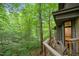 Outdoor wooden deck surrounded by green trees at 106 Mill Rock Ct, Carrboro, NC 27510