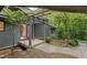 Covered entrance with a wooden deck and pergola, leading to the front door at 106 Mill Rock Ct, Carrboro, NC 27510