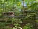 View of a home showcasing decks and lush landscaping, offering a private and serene outdoor living experience at 106 Mill Rock Ct, Carrboro, NC 27510
