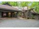 Beautiful home with a covered entrance, attached carport, and mature landscaping at 106 Mill Rock Ct, Carrboro, NC 27510