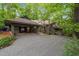Lovely home with a covered entrance, carport, and gravel driveway at 106 Mill Rock Ct, Carrboro, NC 27510