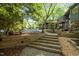 Inviting front entrance with stone walkway and professional landscaping leading up to the attractive home at 106 Mill Rock Ct, Carrboro, NC 27510