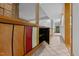 Hallway with colorful wood cabinetry that opens to reveal storage space at 106 Mill Rock Ct, Carrboro, NC 27510
