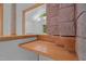 Modern interior architecture showcasing a stacked brick wall and natural lighting at 106 Mill Rock Ct, Carrboro, NC 27510