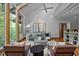 Open-concept living room with skylights, comfortable seating, and hardwood floors at 106 Mill Rock Ct, Carrboro, NC 27510