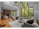Large living room with cathedral ceilings, a fireplace, and forest views at 106 Mill Rock Ct, Carrboro, NC 27510